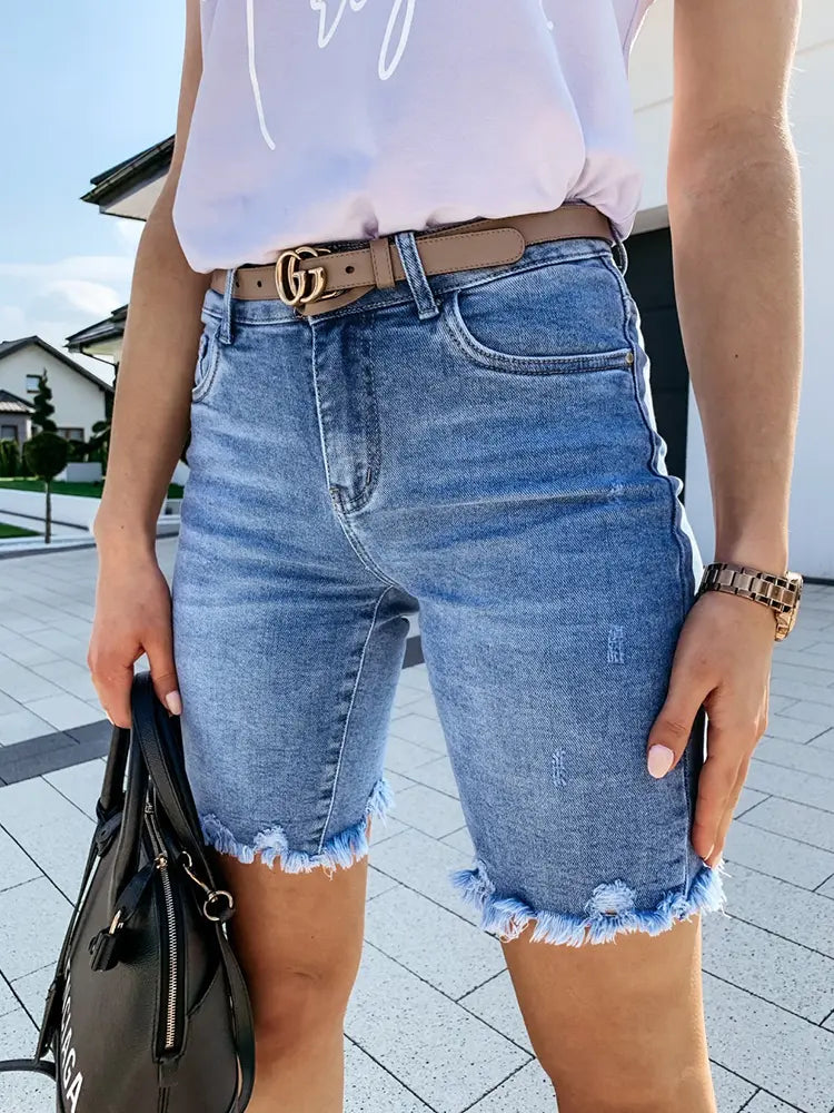 Front view of distressed denim shorts