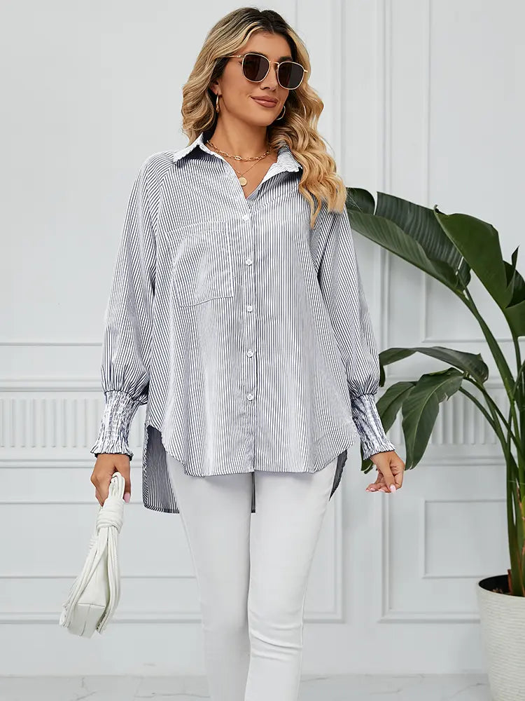 Back view of striped loose-fit shirt with pleated cuffs