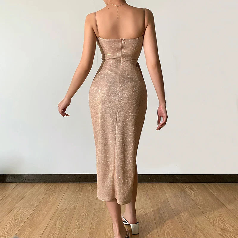 Side view of V-neck gold shimmer dress with slit